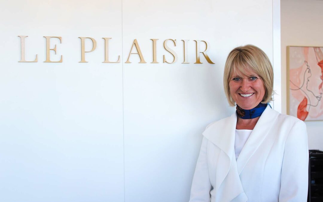Owner of Le Plaisir at retail desk
