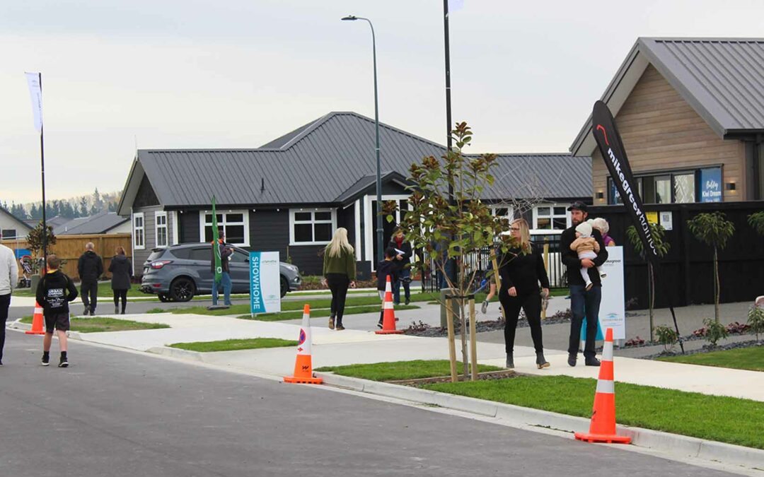 people walking around Silverstream subdivision showhome village