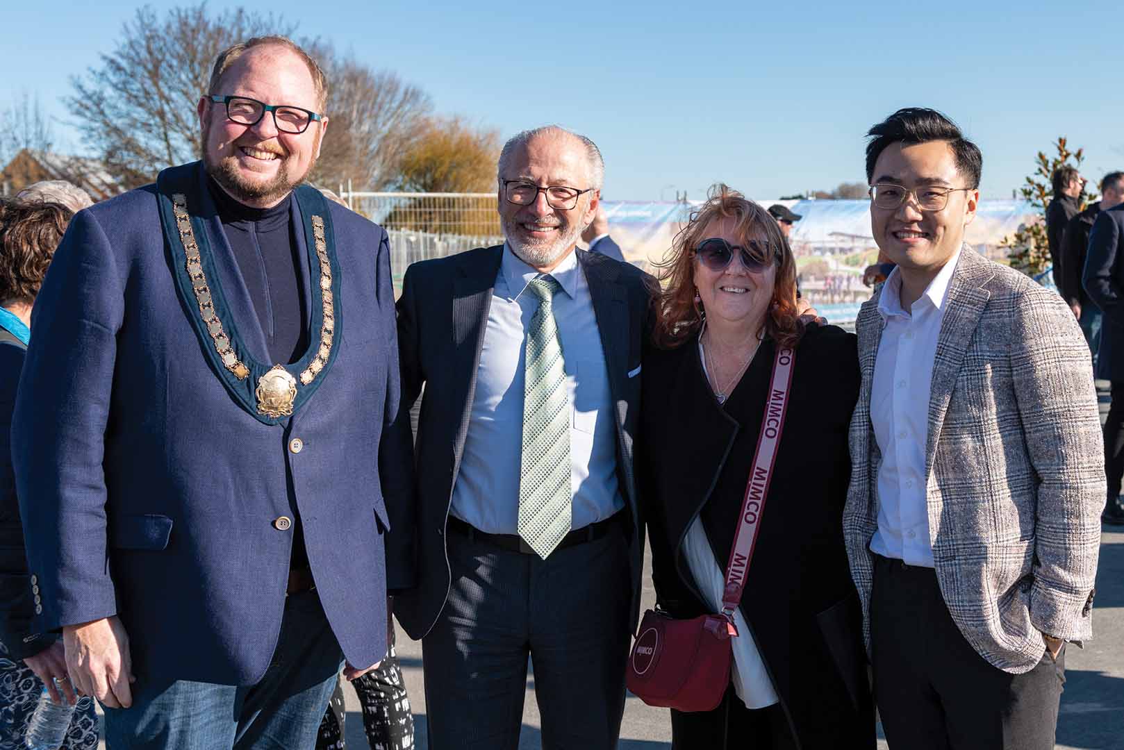 the mayor standing beside the land developers at the opening of Silverstream Boulevard