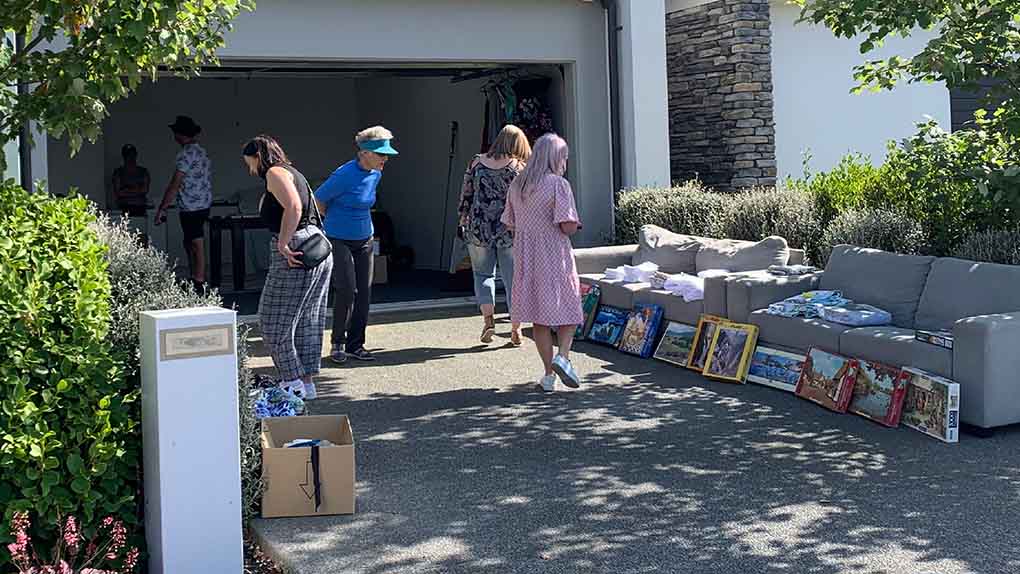 people looking through items at a garage sale