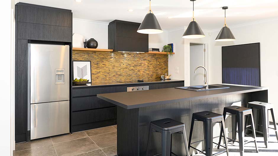 black themed kitchen with four breakfast stools