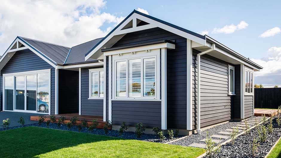 modern grey weatherboard house with white trims