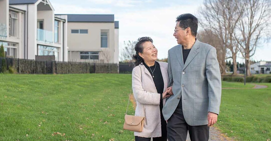 Couple walking by the river running through Silverstream